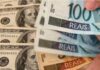 Dólar testa R$ 5,35: impacto em viagens, importados e Bolsa Notas de dólar americano sobre real brasileiro ilustrando alta cambial.